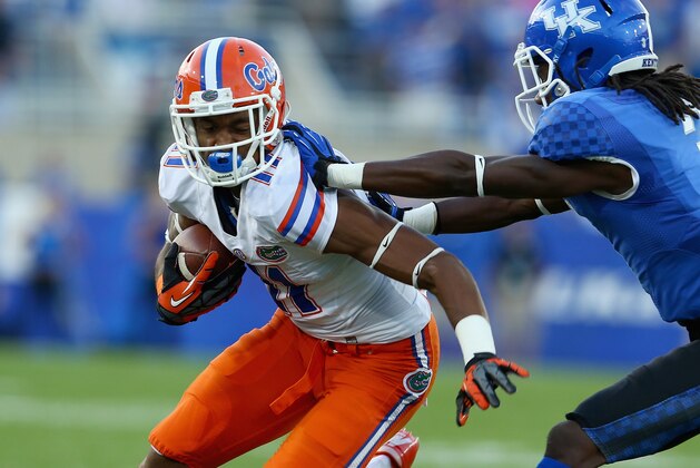 LEXINGTON, KY - SEPTEMBER 28:  Demarcus Robinson #11  of the Florida Gators runs with the ball while defended by Fred Tiller #3 of the Kentucky Wildcats during the game at Commonwealth Stadium on September 28, 2013 in Lexington, Kentucky.  (Photo by Andy Lyons/Getty Images)