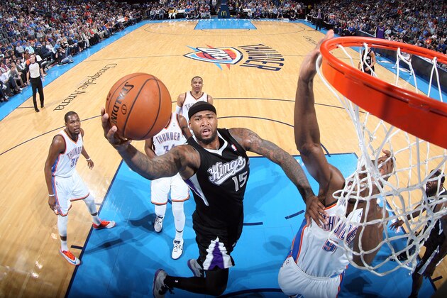 OKLAHOMA CITY, OK - MARCH 28: DeMarcus Cousins #15 of the Sacramento Kings shoots against the Oklahoma City Thunder on March 28, 2014 at the Chesapeake Energy Arena in Oklahoma City, Oklahoma. NOTE TO USER: User expressly acknowledges and agrees that, by downloading and or using this Photograph, user is consenting to the terms and conditions of the Getty Images License Agreement. Mandatory Copyright Notice: Copyright 2014 NBAE (Photo by Layne Murdoch/NBAE via Getty Images)