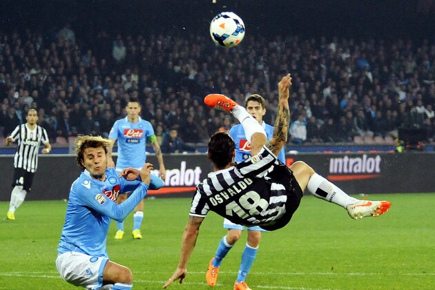 Juventus striker Osvaldo goes for an overhead kick past Napoli's Henrique during a Serie A soccer match between Napoli and Juventus, at the San Paolo stadium in Naples, Italy, Sunday, March, 30, 2014. (AP Photo/Salvatore Laporta)