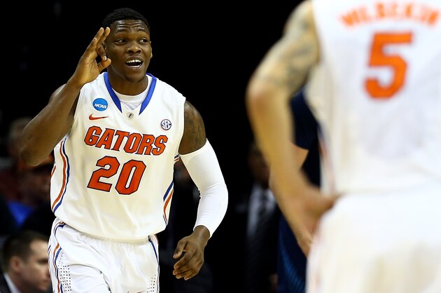 MEMPHIS, TN - MARCH 27:  Michael Frazier II #20 of the Florida Gators reacts after hitting a shot against the UCLA Bruins during a regional semifinal of the 2014 NCAA Men's Basketball Tournament at the FedExForum on March 27, 2014 in Memphis, Tennessee.  (Photo by Streeter Lecka/Getty Images)