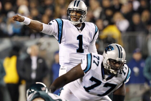 Carolina Panthers quarterback Cam Newton (1) calls signals near tackle Byron Bell (77) in the first half of an NFL football game against the Philadelphia Eagles, Monday, Nov. 26, 2012, in Philadelphia. (AP Photo/Mel Evans) Carolina Panthers quarterback Cam Newton (1) calls signals near tackle Byron Bell (77) in the first half of an NFL football game against the Philadelphia Eagles, Monday, Nov. 26, 2012, in Philadelphia. (AP Photo/Mel Evans)