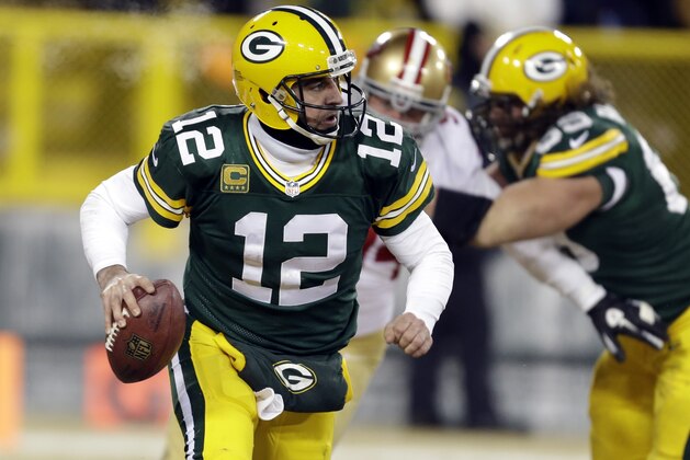 Green Bay Packers quarterback Aaron Rodgers (12) scrambles during the second half of an NFL wild-card playoff football game against the San Francisco 49ers, Sunday, Jan. 5, 2014, in Green Bay, Wis. (AP Photo/Mike Roemer)
