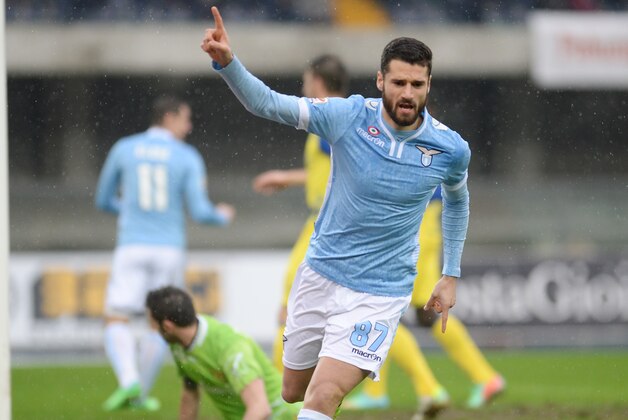 Lazio's Antonio Candreva celebrates after scoring his side's third goal during a Serie A soccer match between Lazio and Parma at Rome's Olympic stadium, Sunday, March 30, 2014. Lazio won 3-2. (AP Photo/Gregorio Borgia)