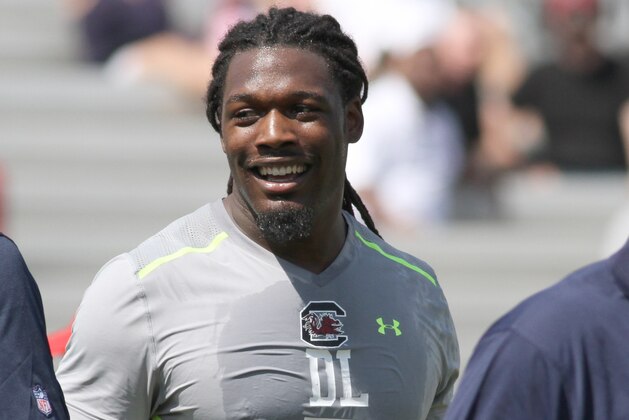 South Carolina defensive end Jadeveon Clowney, center, talks during South Carolina's pro day in Columbia, S.C., Wednesday, April 2, 2014. (AP Photo/Mary Ann Chastain)