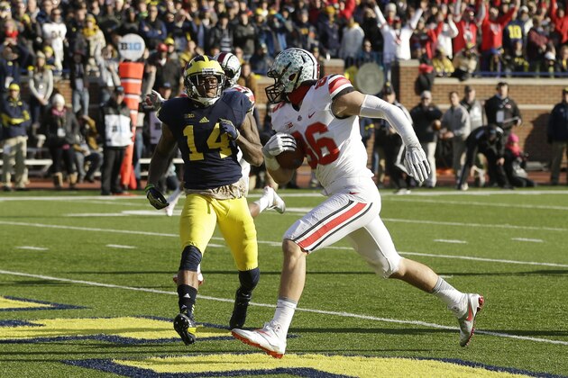 Ohio State tight end Jeff Heuerman (86), defended by Michigan safety Josh Furman (14), scores during the second half of an NCAA college football game in Ann Arbor, Mich., Saturday, Nov. 30, 2013. (AP Photo/Carlos Osorio) Ohio State tight end Jeff Heuerman (86), defended by Michigan safety Josh Furman (14), scores during the second half of an NCAA college football game in Ann Arbor, Mich., Saturday, Nov. 30, 2013. (AP Photo/Carlos Osorio)