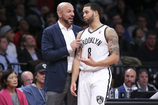 Brooklyn Nets head coach Jason Kidd and guard Deron Williams (8) speak at the bench during the second half of their NBA basketball game against the Houston Rockets at the Barclays Center, Tuesday, April 1, 2014, in New York. The Nets defeated the Rockets, 105-96. (AP Photo/John Minchillo)