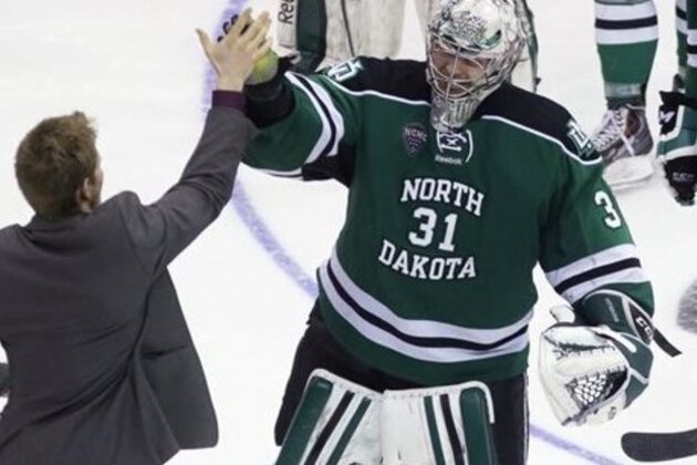 North Dakota goalie Zane Gothberg (31) is congratulated after North Dakota defeated Ferris State 2-1 in two overtimes in a regional final of the NCAA men's college hockey tournament, Saturday, March 29, 2014, in Cincinnati. (AP Photo/Al Behrman) North Dakota goalie Zane Gothberg (31) is congratulated after North Dakota defeated Ferris State 2-1 in two overtimes in a regional final of the NCAA men's college hockey tournament, Saturday, March 29, 2014, in Cincinnati. (AP Photo/Al Behrman)