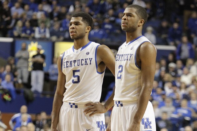 Kentucky's Andrew Harrison (5) and Aaron Harrison (2) during an NCAA college basketball game against Mississippi, Tuesday, Feb. 4, 2014, in Lexington, Ky. Kentucky won 80-64. (AP Photo/James Crisp)