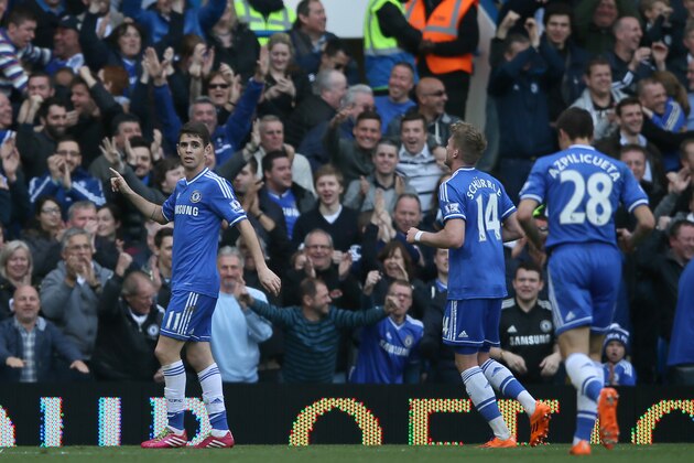 Chelsea's Oscar celebrates after scoring his side's 5th goal during their English Premier League soccer match between Chelsea and Arsenal at Stamford Bridge stadium in London, Saturday, March,  22, 2014. (AP Photo/Alastair Grant)