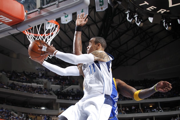 Dallas Mavericks guard Monta Ellis (11) shoots over Golden State Warriors guard Klay Thompson in the second half of an NBA basketball game, Tuesday, April 1, 2014, in Dallas. Golden State won 122-120 in overtime. (AP Photo/Matt Strasen)