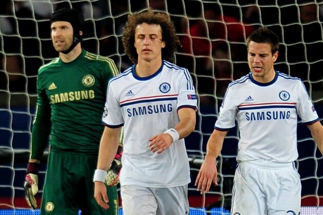 PARIS, FRANCE - APRIL 02:  A dejected David Luiz (C) of Chelsea looks on after scoring an own goal to give PSG a 2-1 lead during the UEFA Champions League quarter final, first leg match between Paris Saint Germain and Chelsea at Parc des Princes on April 2, 2014 in Paris, France.  (Photo by Shaun Botterill/Getty Images)
