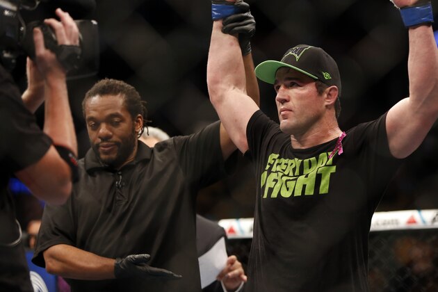 Chael Sonnen, right, is declared the victor after his match against Mauricio 'Shogun' Rua, of Brazil, in their UFC on Fox Sports 1 mixed martial arts light heavyweight bout in Boston, Saturday, Aug. 17,2013.  Sonnen won via first-round tapout via guillotine choke. (AP Photo/Gregory Payan)