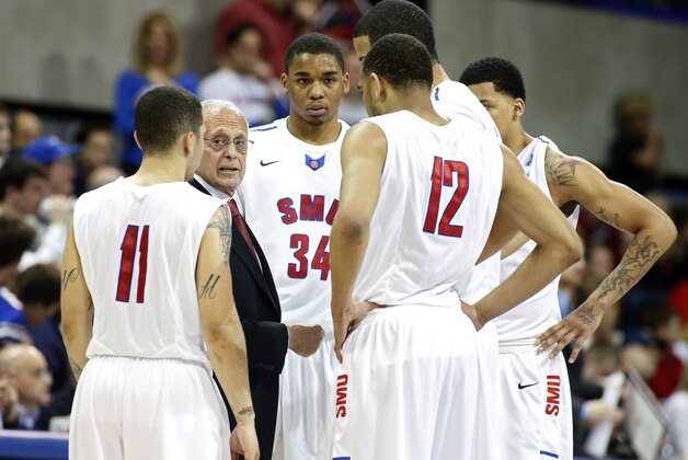 SMU head coach Larry Brown talks to his team in a timeout during the first half of an NCAA college basketball game against California in the quarterfinals of the NIT Wednesday, March 26, 2014, in Dallas. SMU won 67-65. (AP Photo/Sharon Ellman)