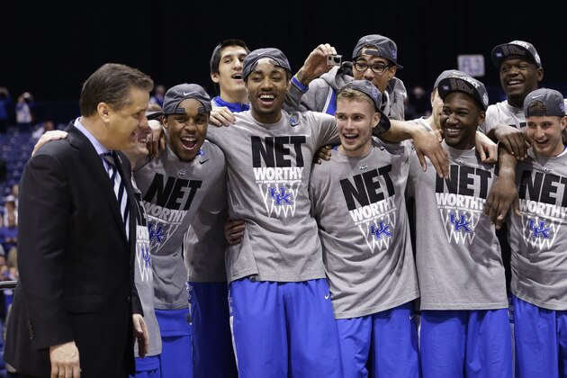 Kentucky head coach John Calipari, left, and players celebrate after an NCAA Midwest Regional final college basketball tournament game Sunday, March 30, 2014, in Indianapolis. Kentucky won 75-72 to advance to the Final Four. (AP Photo/David J. Phillip) Kentucky head coach John Calipari, left, and players celebrate after an NCAA Midwest Regional final college basketball tournament game Sunday, March 30, 2014, in Indianapolis. Kentucky won 75-72 to advance to the Final Four. (AP Photo/David J. Phillip)