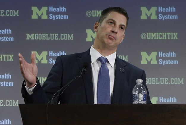 Doug Nussmeier is introduced as Michigan's NCAA college football offensive coordinator and quarterbacks coach during a news conference at the Junge Center in Ann Arbor, Mich., Friday, Jan. 10, 2014. Nussmeier is the former Alabama offensive coordinator. (AP Photo/Carlos Osorio)