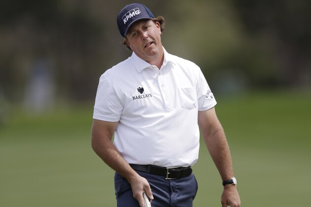 Phil Mickelson reacts as he misses an eagle putt on the 14th hole during the third round of the Texas Open golf tournament, Saturday, March 29, 2014, in San Antonio. Mickelson withdrew from the tournament with a pulled muscle. (AP Photo/Eric Gay) Phil Mickelson reacts as he misses an eagle putt on the 14th hole during the third round of the Texas Open golf tournament, Saturday, March 29, 2014, in San Antonio. Mickelson withdrew from the tournament with a pulled muscle. (AP Photo/Eric Gay)