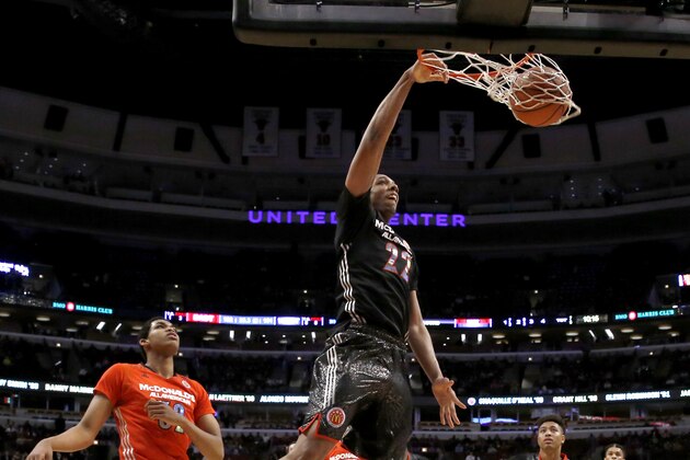 McDonald's West All-American Jahlil Okafor dunks the ball past McDonald's East All-American Karl-Anthony Towns, left, during the second half of the McDonald's All-American boy's basketball game Wednesday, April 2, 2014, in Chicago. The West won 105-102. (AP Photo/Charles Rex Arbogast)
