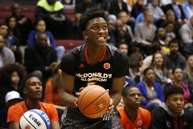 McDonald's West All-American Stanley Johnson, of Fullerton, Calif., competes in the three-point shootout during the McDonald's All-American Jam Fest at the University of Chicago in Chicago, on Monday, March 31, 2014. (AP Photo/Andrew A. Nelles)