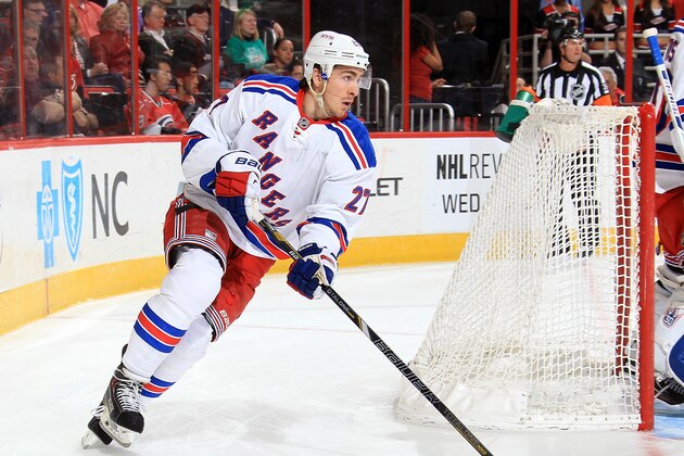 RALEIGH, NC - MARCH 11:  Ryan McDonagh #27 of the New York Rangers corrals the puck behind the net during an NHL game against the Carolina Hurricanes at PNC Arena on March 11, 2014 in Raleigh, North Carolina.  (Photo by Gregg Forwerck/NHLI via Getty Images)