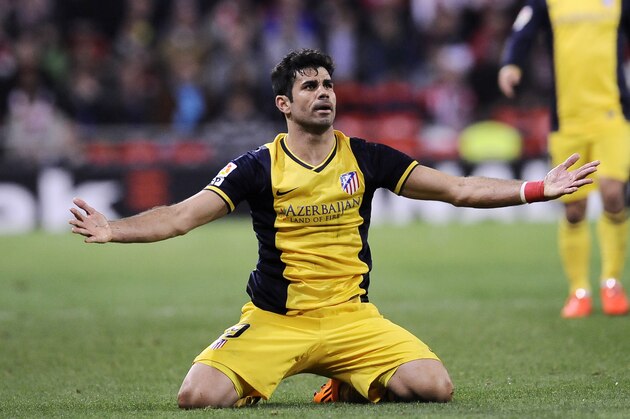 Atletico de Madrid's Diego Costa of Brazil, front, protests a decision by the referee during their Spanish League soccer match against Athletic Bilbao., at San Mames stadium in Bilbao, Spain, Saturday, March 29, 2014. Athletico de Madrid won the match 2-1. (AP Photo/Alvaro Barrientos)