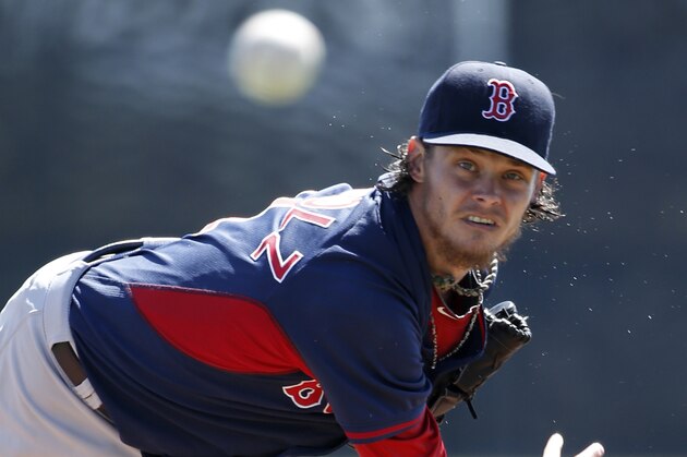 Boston Red Sox starting pitcher Clay Buchholz delivers a warm-up pitch before the start of a spring exhibition baseball game against the Toronto Blue Jays in Dunedin, Fla., Friday, March 14, 2014.  Buchholz allowed no runs on two hits with three strikeouts in four innings. (AP Photo/Kathy Willens)