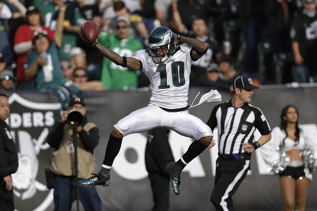 Philadelphia Eagles wide receiver DeSean Jackson (10) celebrates as he scores on a 46-yard touchdown pass from quarterback Nick Foles during the third quarter of an NFL football game against the Oakland Raiders in Oakland, Calif., Sunday, Nov. 3, 2013. (AP Photo/Marcio Jose Sanchez)