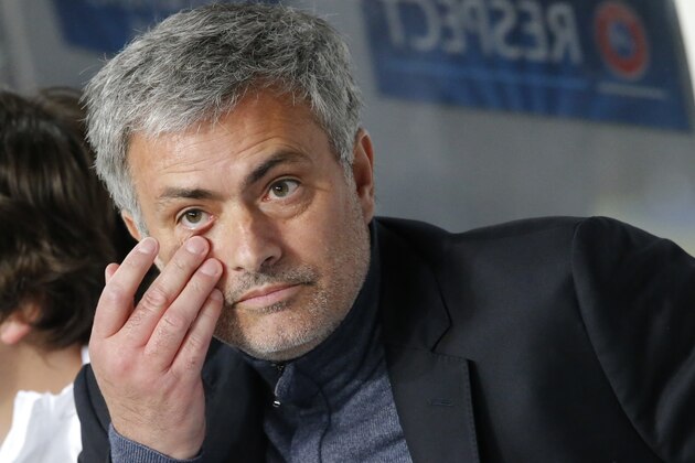 Chelsea's manager Jose Mourinho sits in the technical area prior to the start of the Champions League quarterfinal first leg soccer match between Paris Saint-Germain and Chelsea at Parc des Princes stadium in Paris, Wednesday, April 2, 2014. (AP Photo/Michel Euler)
