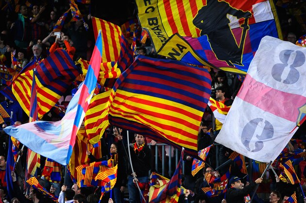 BARCELONA, SPAIN - APRIL 01:  Barcelona fans wave their flags during the UEFA Champions League Quarter Final first leg match between FC Barcelona and Club Atletico de Madrid at Camp Nou on April 1, 2014 in Barcelona, Spain.  (Photo by David Ramos/Getty Images)