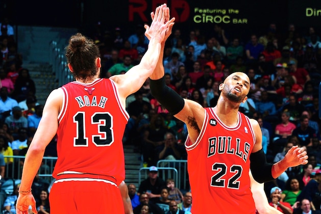 Atlanta Hawks forward Paul Millsap (4) drives against Chicago Bulls center Joakim Noah (13) in the first half of an NBA basketball game Wednesday, April 2, 2014, in Atlanta. The Bulls won 105-92. (AP Photo/Jason Getz)