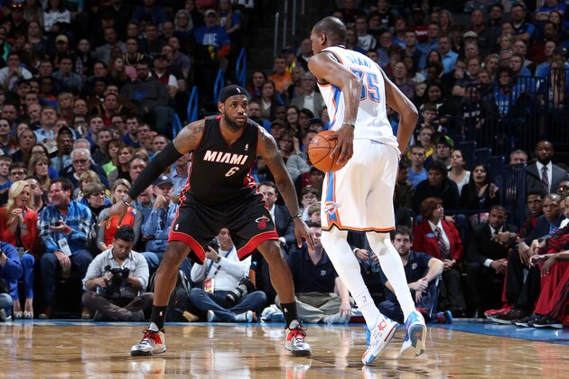OKLAHOMA CITY, OK - FEBRUARY 20: LeBron James #6 of the Miami Heat defends against Kevin Durant #35 of the Oklahoma City Thunder on February 20, 2014 at the Chesapeake Energy Arena in Oklahoma City, Oklahoma. NOTE TO USER: User expressly acknowledges and agrees that, by downloading and or using this Photograph, user is consenting to the terms and conditions of the Getty Images License Agreement. Mandatory Copyright Notice: Copyright 2014 NBAE (Photo by Layne Murdoch/NBAE via Getty Images)