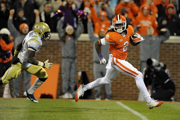 Clemson wide receiver Sammy Watkins races in for a 44-yard touchdown while being pursued by Georgia Tech's Jemea Thomas during the second half of an NCAA college football game Thursday, Nov.14, 2013, in Clemson, S.C. Clemson won 55-31. (AP Photo/ Richard Shiro)
