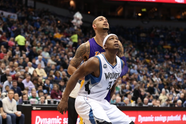 MINNEAPOLIS, MN - MARCH 28: Dante Cunningham #33 of the Minnesota Timberwolves looks to rebound the ball during the game against the Los Angeles Lakers on March 28, 2014 at Target Center in Minneapolis, Minnesota. NOTE TO USER: User expressly acknowledges and agrees that, by downloading and or using this Photograph, user is consenting to the terms and conditions of the Getty Images License Agreement. Mandatory Copyright Notice: Copyright 2014 NBAE (Photo by Jordan Johnson/NBAE via Getty Images)