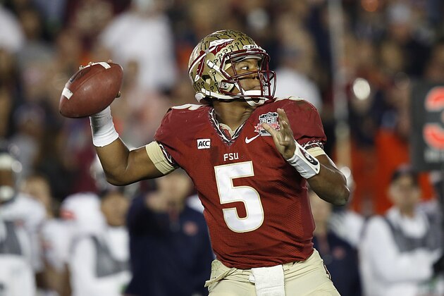 Florida State quarterback Jameis Winston (5) throws a pass against Auburn University in the 2014 BCS Championship NCAA College Football game on Monday, Jan. 6, 2014 in Pasadena, Calif. (AP Photo/Doug Benc)