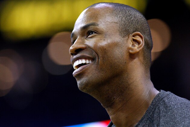 Brooklyn Nets center Jason Collins (98) warms up before an NBA basketball game in New Orleans, Monday, March 24, 2014. (AP Photo/Jonathan Bachman)