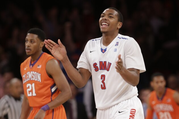 SMU's Sterling Brown (3) and Clemson's Damarcus Harrison (21)react during the second half of an NCAA college basketball game in the semifinals of the NIT Tuesday, April 1, 2014, in New York. SMU won the game 65-59. (AP Photo/Frank Franklin II)