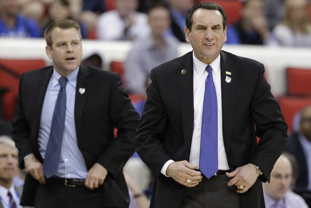 Duke head coach Mike Krzyzewski speaks to players against Mercer during the first half of an NCAA college basketball second-round game, Friday, March 21, 2014, in Raleigh, N.C. (AP Photo/Chuck Burton) Duke head coach Mike Krzyzewski speaks to players against Mercer during the first half of an NCAA college basketball second-round game, Friday, March 21, 2014, in Raleigh, N.C. (AP Photo/Chuck Burton)