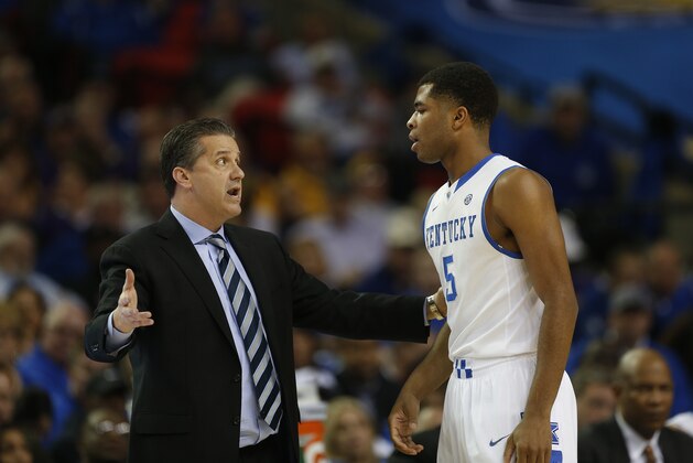 Kentucky head coach John Calipari speaks to Kentucky guard Andrew Harrison (5) against LSU during the first half of an NCAA college basketball game in the quarterfinal round of the Southeastern Conference men's tournament, Friday, March 14, 2014, in Atlanta. (AP Photo/John Bazemore)