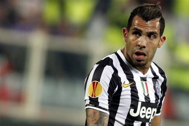 Juventus' Carlos Tevez  walks on the pitch during an Europa League, round of 16, return-leg soccer  match between Fiorentina and Juventus at the Artemio Franchi stadium in Florence, Italy, Thursday, March 20, 2014. (AP Photo/Fabrizio Giovannozzi)