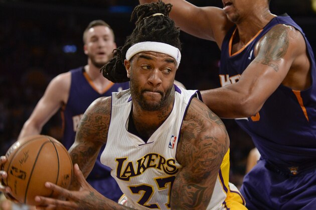 Los Angeles Lakers forward Jordan Hill (27) battles Phoenix Suns forward Channing Frye, back right, in the first half of an NBA basketball game, Sunday, March 30, 2014, in Los Angeles.(AP Photo/Gus Ruelas)