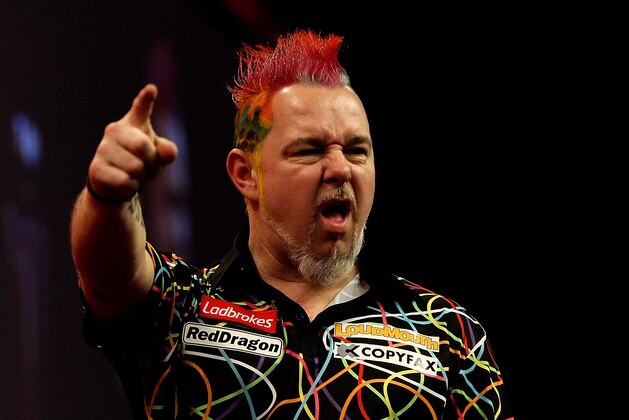 LONDON, ENGLAND - JANUARY 01: Peter Wright of Scotland celebrates winning a set during the final of the Ladbrokes.com World Darts Championships at Alexandra Palace on January 1, 2014 in London, England.  (Photo by Ben Hoskins/Getty Images)