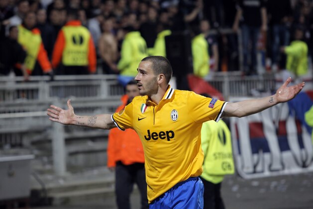 Juventus Turin's Leonardo Bonucci celebrates after he scored a goal against Lyon during their Europa League soccer match in Lyon, central France, Thursday, April 3, 2014. (AP Photo/Laurent Cipriani)