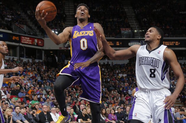 SACRAMENTO, CA - APRIL 2:  Nick Young #0 of the Los Angeles Lakers shoots against the Sacramento Kings at Sleep Train Arena on April 2, 2014 in Sacramento, California. NOTE TO USER: User expressly acknowledges and agrees that, by downloading and or using this photograph, User is consenting to the terms and conditions of the Getty Images Agreement. Mandatory Copyright Notice: Copyright 2014 NBAE (Photo by Rocky Widner/NBAE via Getty Images)