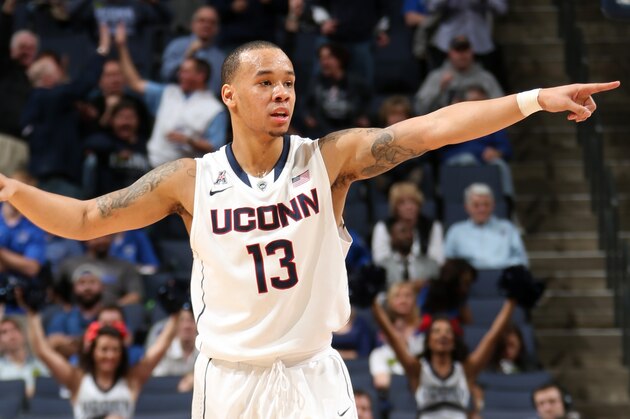 Connecticut guard Shabazz Napier (13) favors his right leg after he was hurt on a play during the second half of a third-round game against Villanova in the NCAA men's college basketball tournament in Buffalo, N.Y., Saturday, March 22, 2014. Connecticut won the game 77-65. (AP Photo/Bill Wippert)
