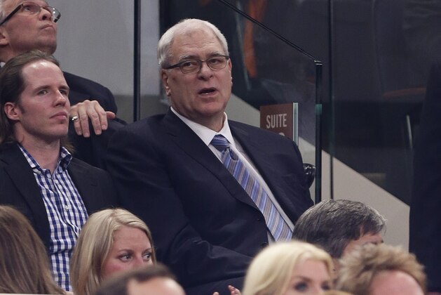 New York Knicks president of basketball operations Phil Jackson watches during the second half of an NBA basketball game between the New York Knicks and the Brooklyn Nets Wednesday, April 2, 2014, in New York. The Knicks won the game 110-81. (AP Photo/Frank Franklin II)