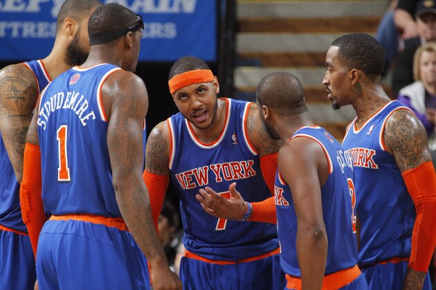 SACRAMENTO, CA - MARCH 26: Carmelo Anthony #7 of the New York Knicks speaks to his teammates against the Sacramento Kings on March 26, 2014 at Sleep Train Arena in Sacramento, California. NOTE TO USER: User expressly acknowledges and agrees that, by downloading and or using this photograph, User is consenting to the terms and conditions of the Getty Images Agreement. Mandatory Copyright Notice: Copyright 2014 NBAE (Photo by Rocky Widner/NBAE via Getty Images)