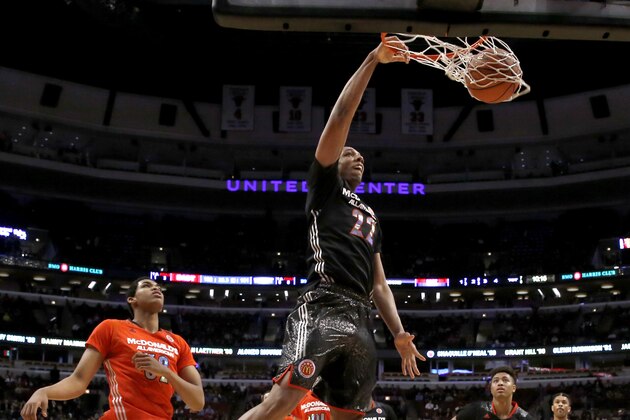 McDonald's West All-American Jahlil Okafor dunks the ball past McDonald's East All-American Karl-Anthony Towns, left, during the second half of the McDonald's All-American boy's basketball game Wednesday, April 2, 2014, in Chicago. The West won 105-102. (AP Photo/Charles Rex Arbogast)