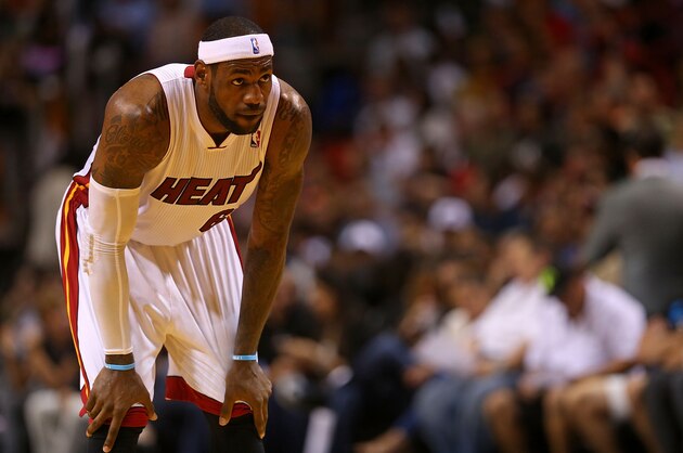MIAMI, FL - APRIL 02:  LeBron James #6 of the Miami Heat looks on during a game against the Milwaukee Bucks at American Airlines Arena on April 2, 2014 in Miami, Florida. NOTE TO USER: User expressly acknowledges and agrees that, by downloading and/or using this photograph, user is consenting to the terms and conditions of the Getty Images License Agreement. Mandatory copyright notice:  (Photo by Mike Ehrmann/Getty Images)