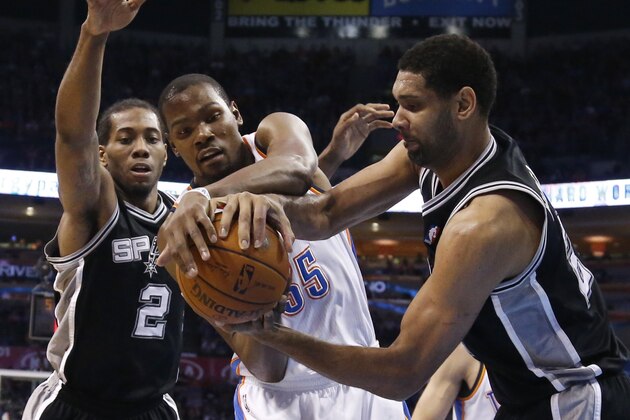 Oklahoma City Thunder forward Kevin Durant (35) and San Antonio Spurs forward Tim Duncan, right, vie for control of the ball in front of Spurs forward Kawhi Leonard (2) during the first quarter of an NBA basketball game in Oklahoma City, Thursday, April 3, 2014. (AP Photo/Sue Ogrocki) Oklahoma City Thunder forward Kevin Durant (35) and San Antonio Spurs forward Tim Duncan, right, vie for control of the ball in front of Spurs forward Kawhi Leonard (2) during the first quarter of an NBA basketball game in Oklahoma City, Thursday, April 3, 2014. (AP Photo/Sue Ogrocki)