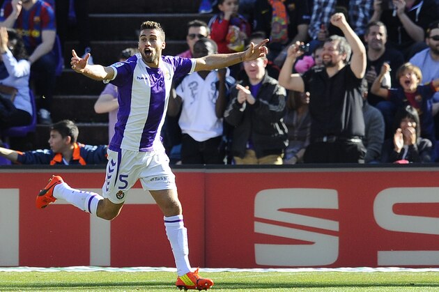 Valladolid's Italian midfielder Fausto Rossi celebrates scoring during a Spanish La Liga soccer match against Barcelona at the Jose Zorrilla stadium in Valladolid, Spain on Saturday March 8, 2014. (AP Photo/Israel L. Murillo)