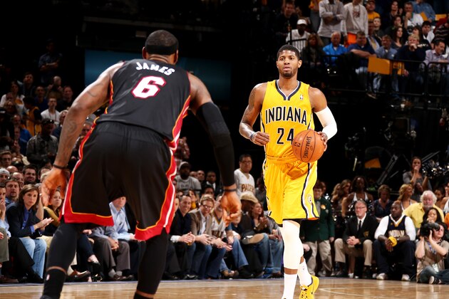 INDIANAPOLIS, IN - MARCH 26: Paul George #24 of the Indiana Pacers brings the ball up court against LeBron James #6 of the Miami Heat during a game on March 26, 2014 at Bankers Life Fieldhouse in Indianapolis, IN.  NOTE TO USER: User expressly acknowledges and agrees that, by downloading and or using this photograph, User is consenting to the terms and conditions of the Getty Images License Agreement. Mandatory Copyright Notice: Copyright 2014 NBAE  (Photo by Nathaniel S. Butler/NBAE via Getty Images)
